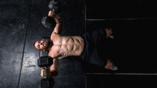 A man doing dumbbell chest press