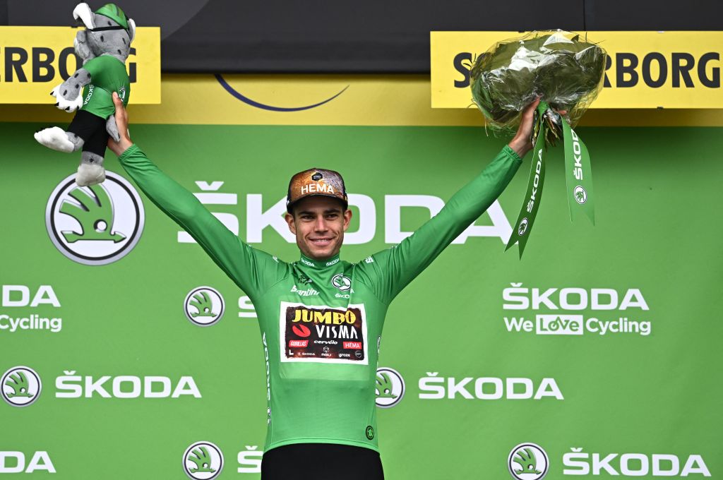 JumboVisma teams Belgian rider Wout Van Aert celebrates with the sprinters green jersey on the podium after the 3rd stage of the 109th edition of the Tour de France cycling race 182 km between Vejle and Sonderborg in Denmark on July 3 2022 Photo by AnneChristine POUJOULAT AFP Photo by ANNECHRISTINE POUJOULATAFP via Getty Images
