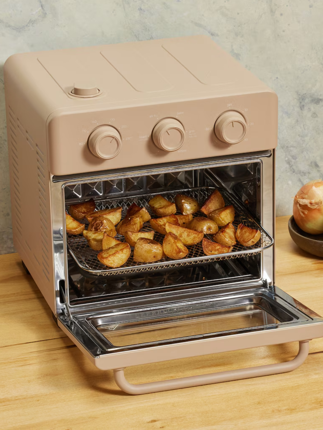 A creamy beige countertop Wonder Oven from Our Place