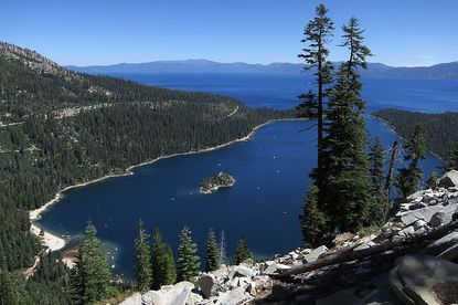 Emerald Bay lies under blue skies at Lake Tahoe on July 23, 2014 near South Lake Tahoe, California. Lake Tahoe is among Califonria's major tourist attractions. 