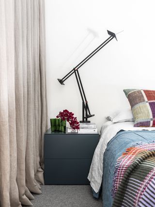A bedside table with statement light