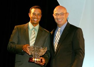 Tiger Woods pictured accepting an award from Tim Rosaforte