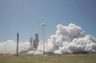 SpaceX’s first Falcon 9 rocket first stage prepared to launch again undergoes a static test fire on Kennedy Space Center's Pad 39A on Monday, March 27, 2017 in Florida.