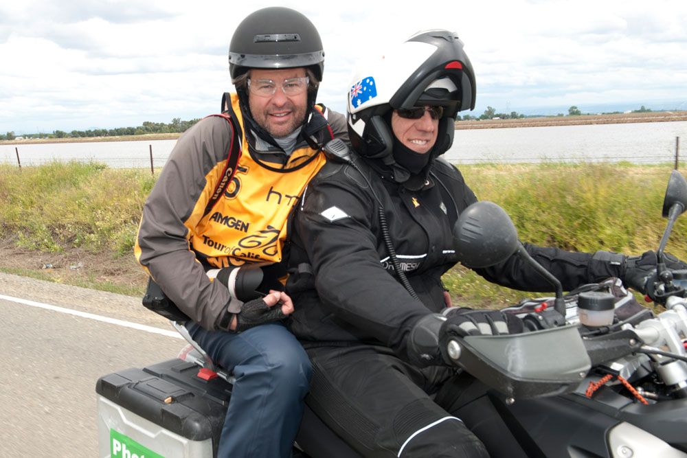 Doug Pensinger rides along with moto pilot Walt Conte at the Tour of California
