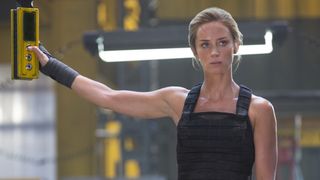 Emily Blunt stands in a military facility in Edge of Tomorrow