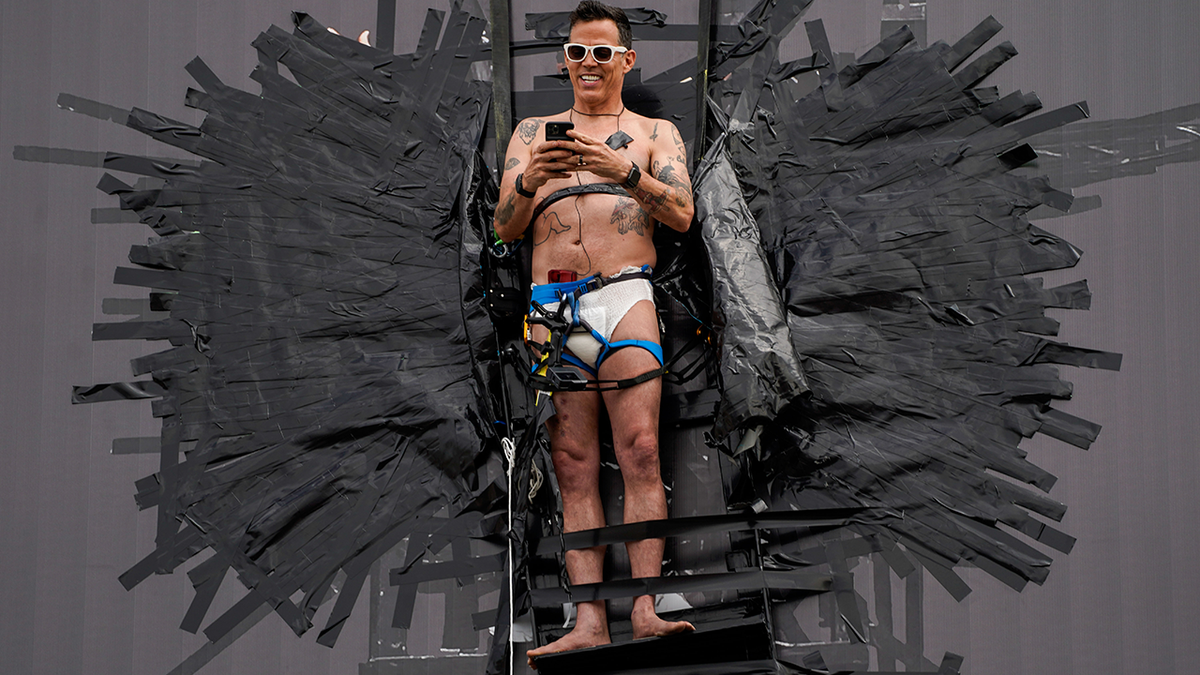 Steve-O is seen taped to a Hollywood billboard along Cahuenga Boulevard 