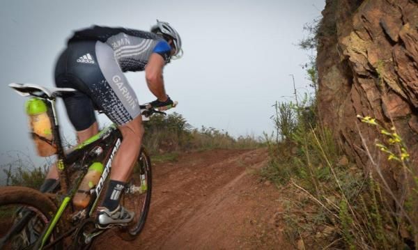 Francois Theron scrambles up a hill