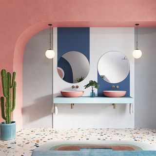 bathroom with coloured basins and terrazzo flooring