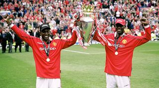 Manchester United's Dwight Yorke and Andy Cole celebrate with the Premier League trophy