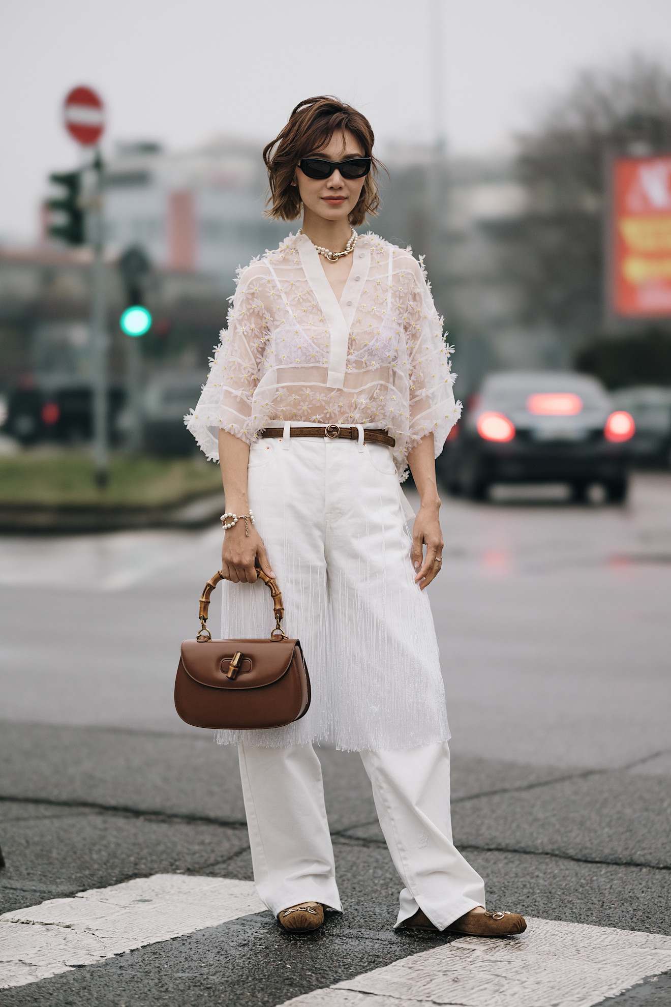 woman wearing pants and sheer top