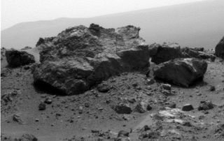 The large rock "Ridout" dominates this photo taken by NASA's Mars rover Opportunity on Aug. 13, 2011 near the rim of the giant Endeavour crater on the Red Planet. Ridout rock is on the edge of a smaller crater, Odyssey, on the rim of Endeavour.