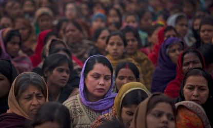 Indian women offer prayers for a gang rape victim during a memorial service on Jan. 2, in New Delhi.