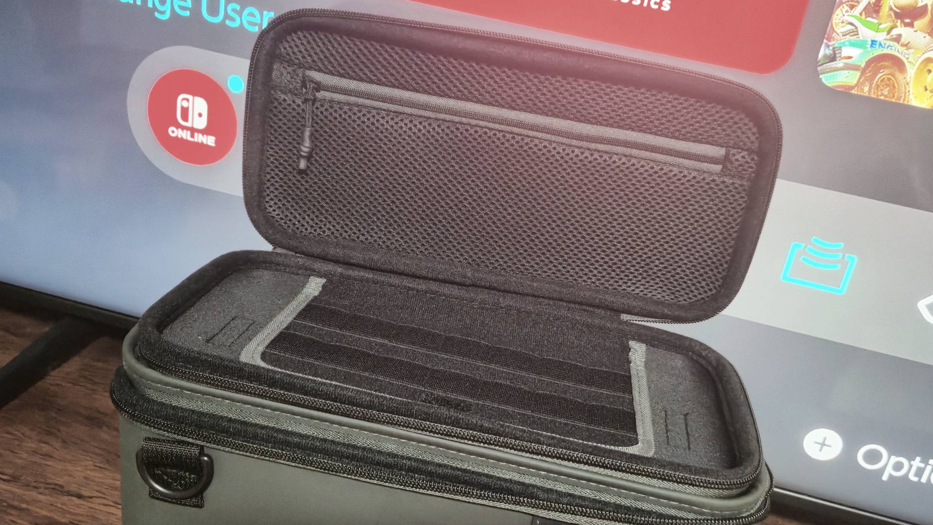Photo of the top case of the PlayTrek 2-in-1 Switch case open, revealing its game and accessories storage inside.