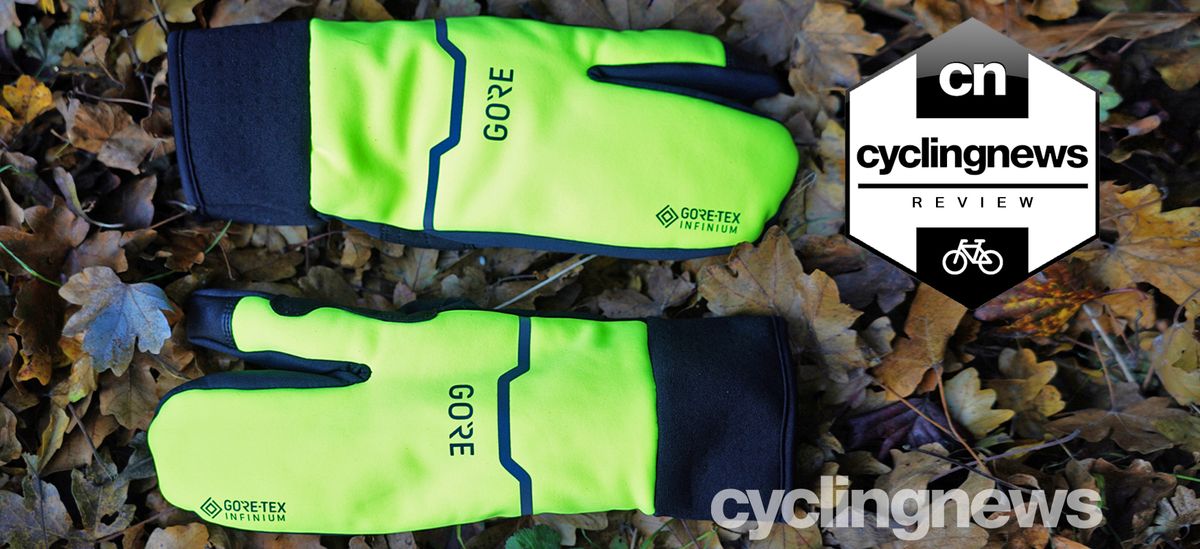 Pair of Gore-Tex Infinium Split gloves on a leafy ground, with cyclingnews &#039;recommends&#039; badge overlaid