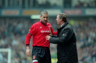 Manchester United manager Sir Alex Ferguson speaks to Eric Cantona during a game against Manchester City in April 1996.