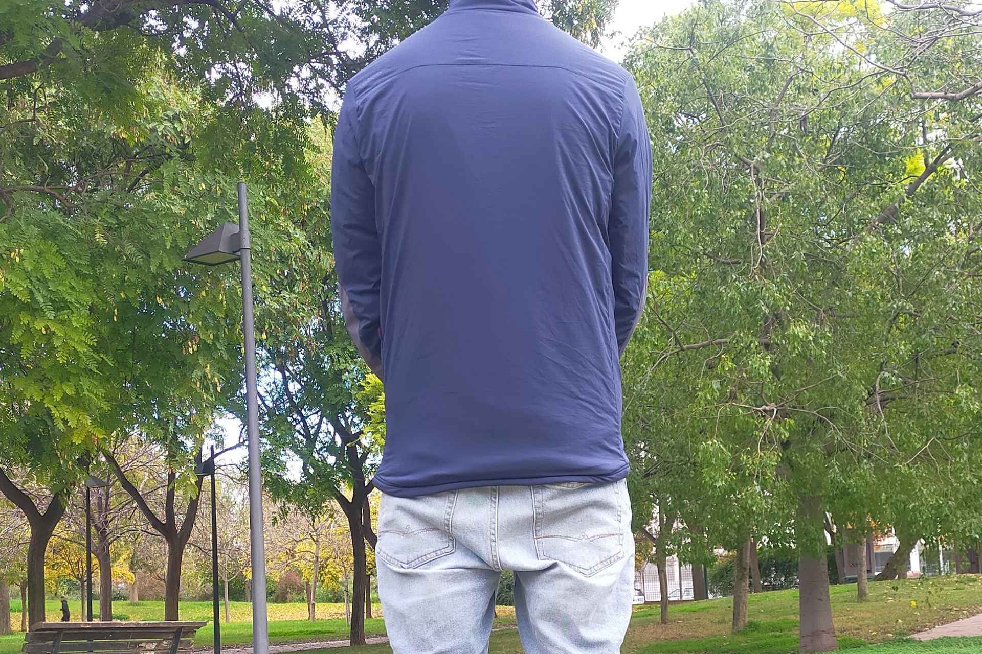 Image shows a rider wearing the Velocio Recon Snap Jacket