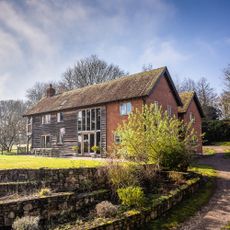 exterior with house and garden area with plant