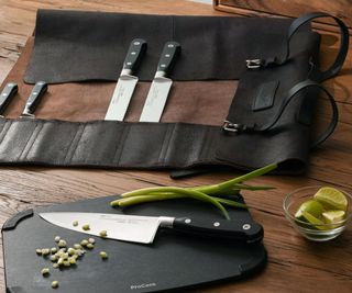 A knife set on a wooden kitchen counter