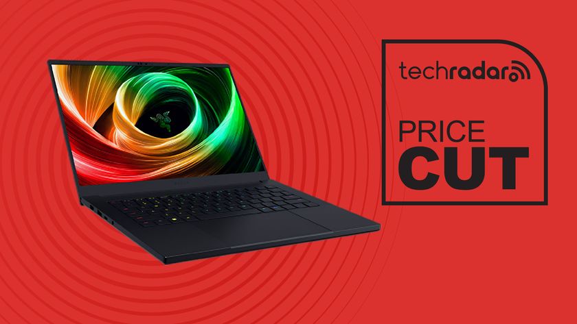 Razer Blade 14 (2025) Gaming Laptop NVIDIA GeForce RTX 5060 on red background with TechRadar price cut sign
