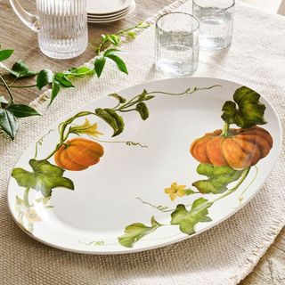 Rustic Pumpkin Serving Platter on a tablecloth.