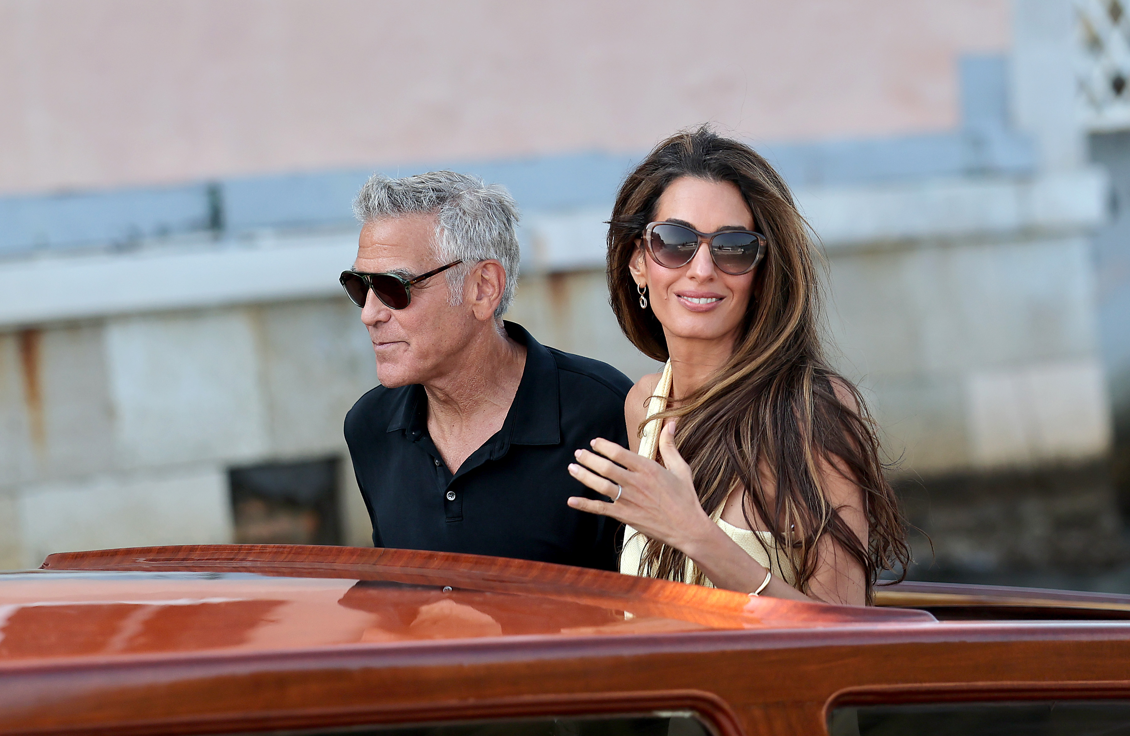 george and amal clooney on a boat