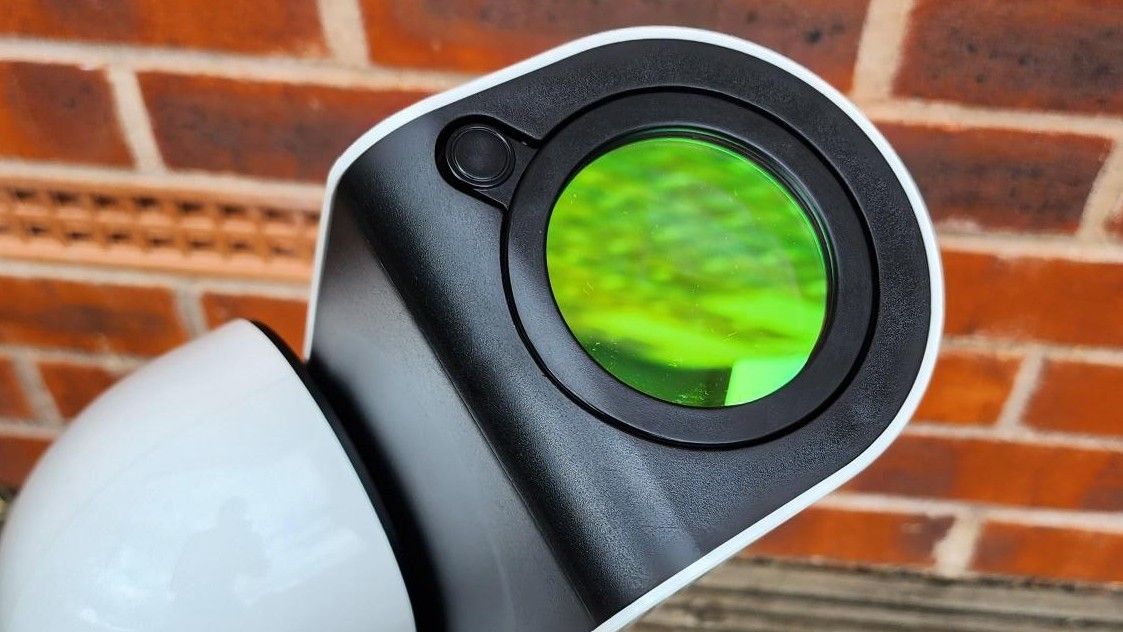 A close up of the Vaonis light pollution filter fixed up on the Vaonis Vespera Observation Station. It's a green circle with a black outline.
