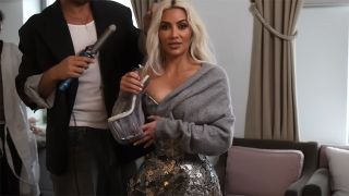 Kim Kardashian shows off her clear wedge heels she wore with 2024 Met Gala look.