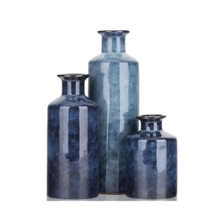 Three indigo colored vases