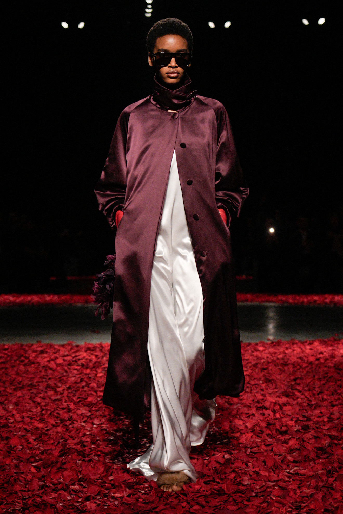 An image of an aubergine coat on Ferragamo's autumn/winter 2025 runway.
