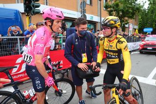 Overall leader INEOS Grenadierss British rider Geraint Thomas L and JumboVismas Slovenian rider Primoz Roglic talk after crossing the finish line of the eleventh stage of the Giro dItalia 2023 cycling race 219 km between Camaiore and Tortona on May 17 2023 Photo by Luca Bettini AFP Photo by LUCA BETTINIAFP via Getty Images