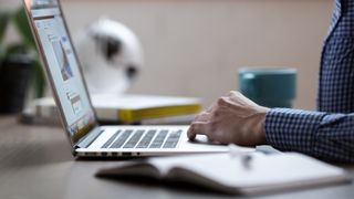 Person reading on laptop