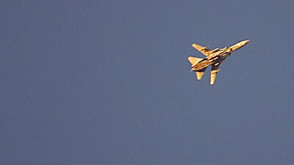 A Syrian fighter jet flying over rebel-held areas