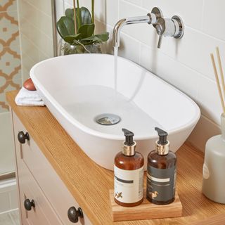 bathroom with wash basin attached cabinet