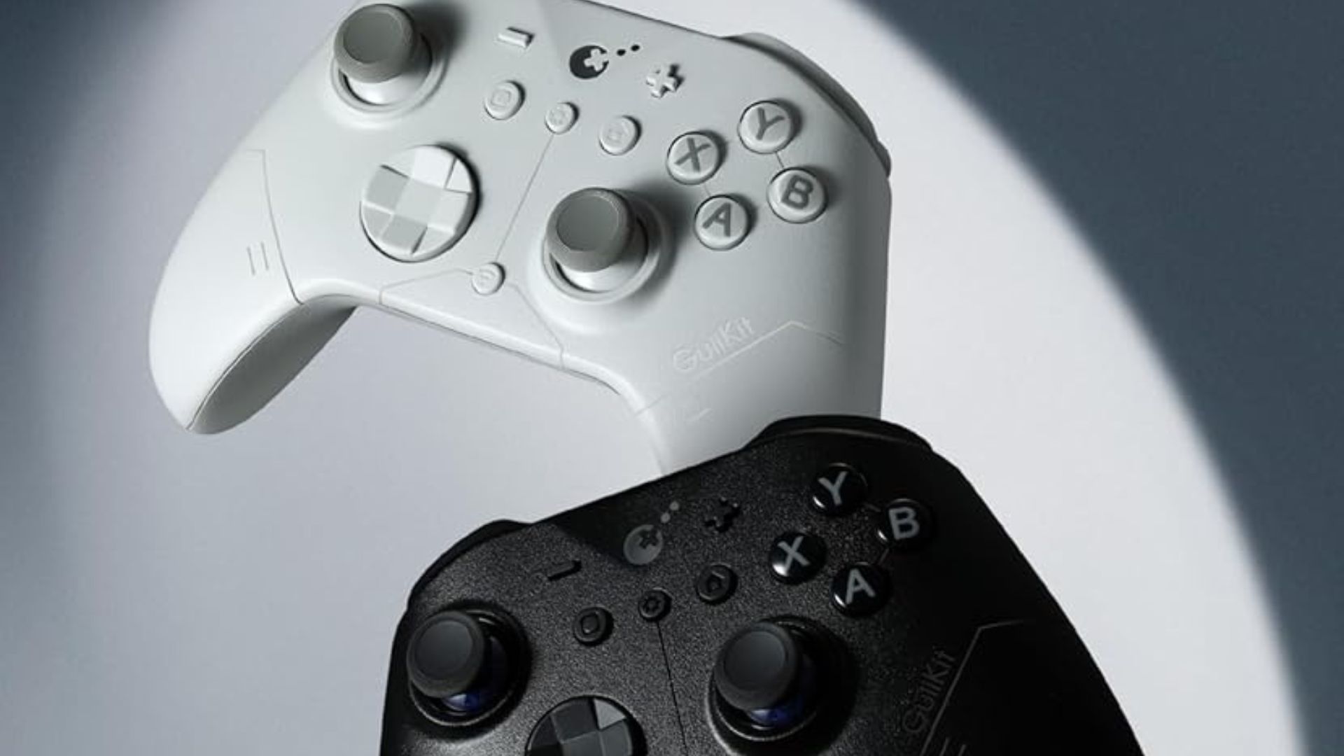 The white GuliKit ES controller above the black ES Pro