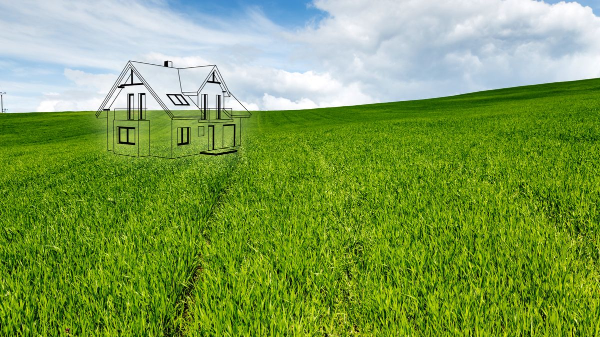 3D outline of house on plot of land with green grass and blue sky behind