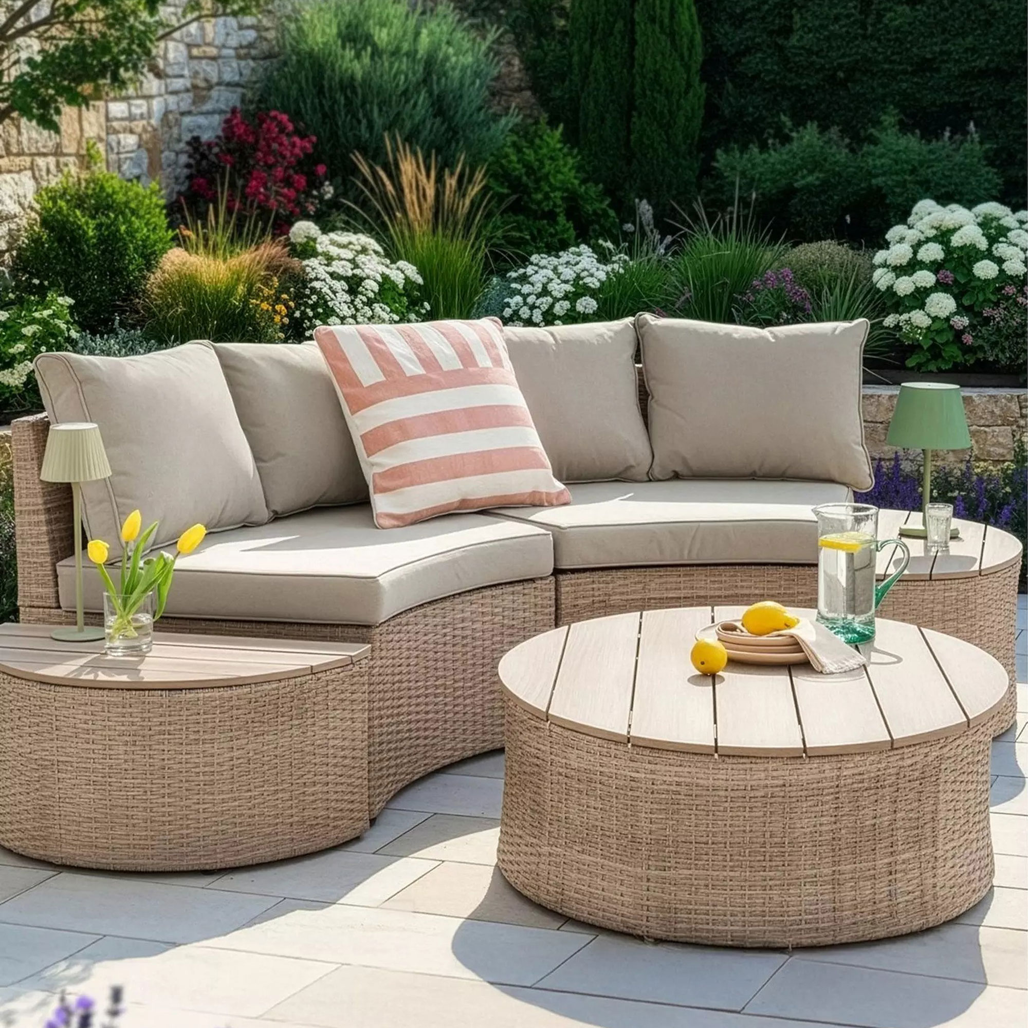Curved garden sofa with side tables and coffee table