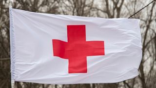Flag of the International Committee of the Red Cross over a medical tent during training of rescuers in Kyiv, Ukraine. March 2021.
