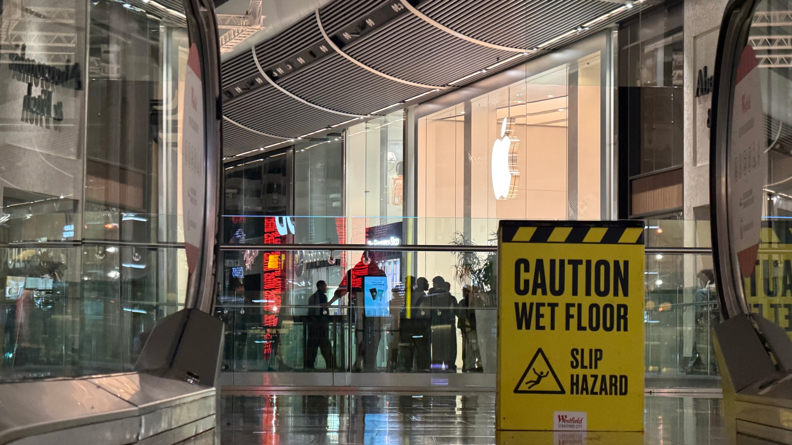 Apple Store and Caution Wet Floor sign
