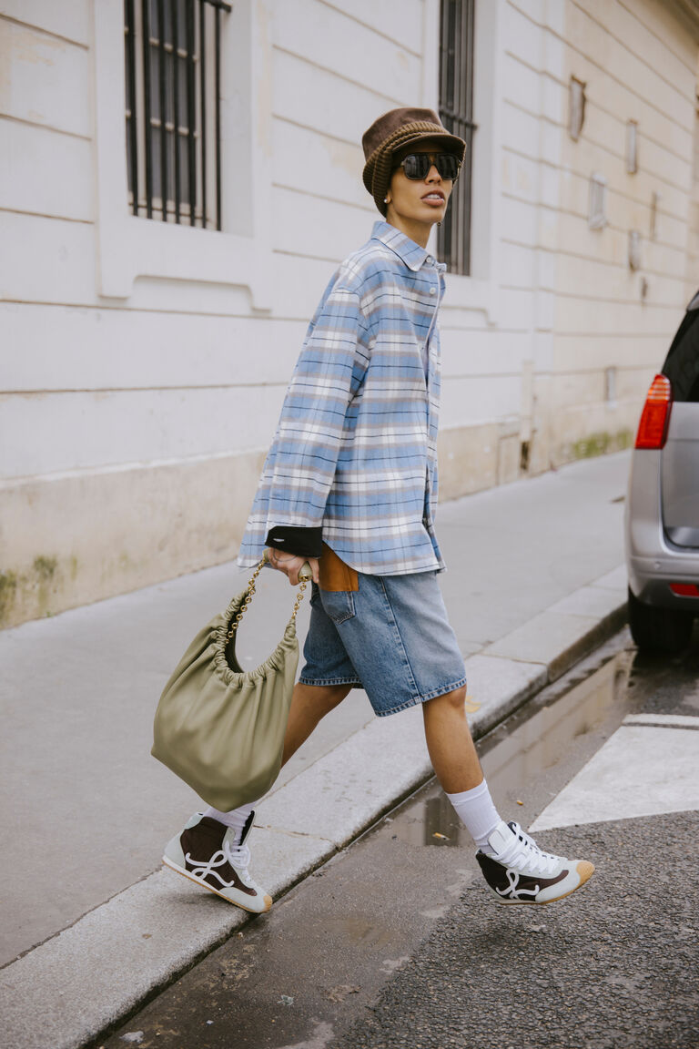 a woman at paris fashion week wearing a high-top version of Loewe&#039;s Ballet Runner.