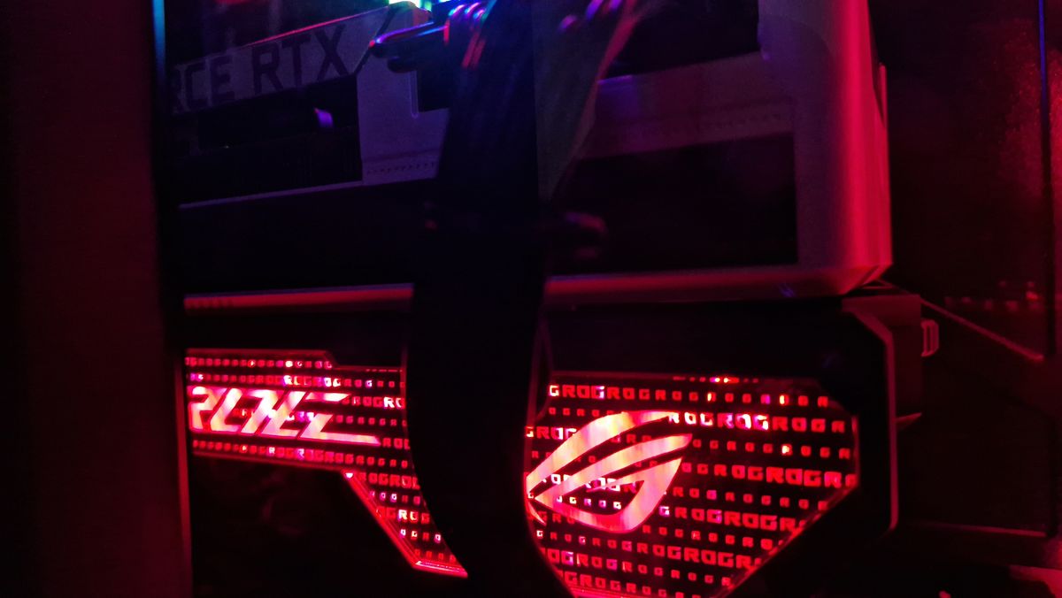 The Asus ROG Herculx GPU support bracket close up with its lights shining red