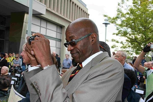 Moses snaps a photo for himself of the statue.