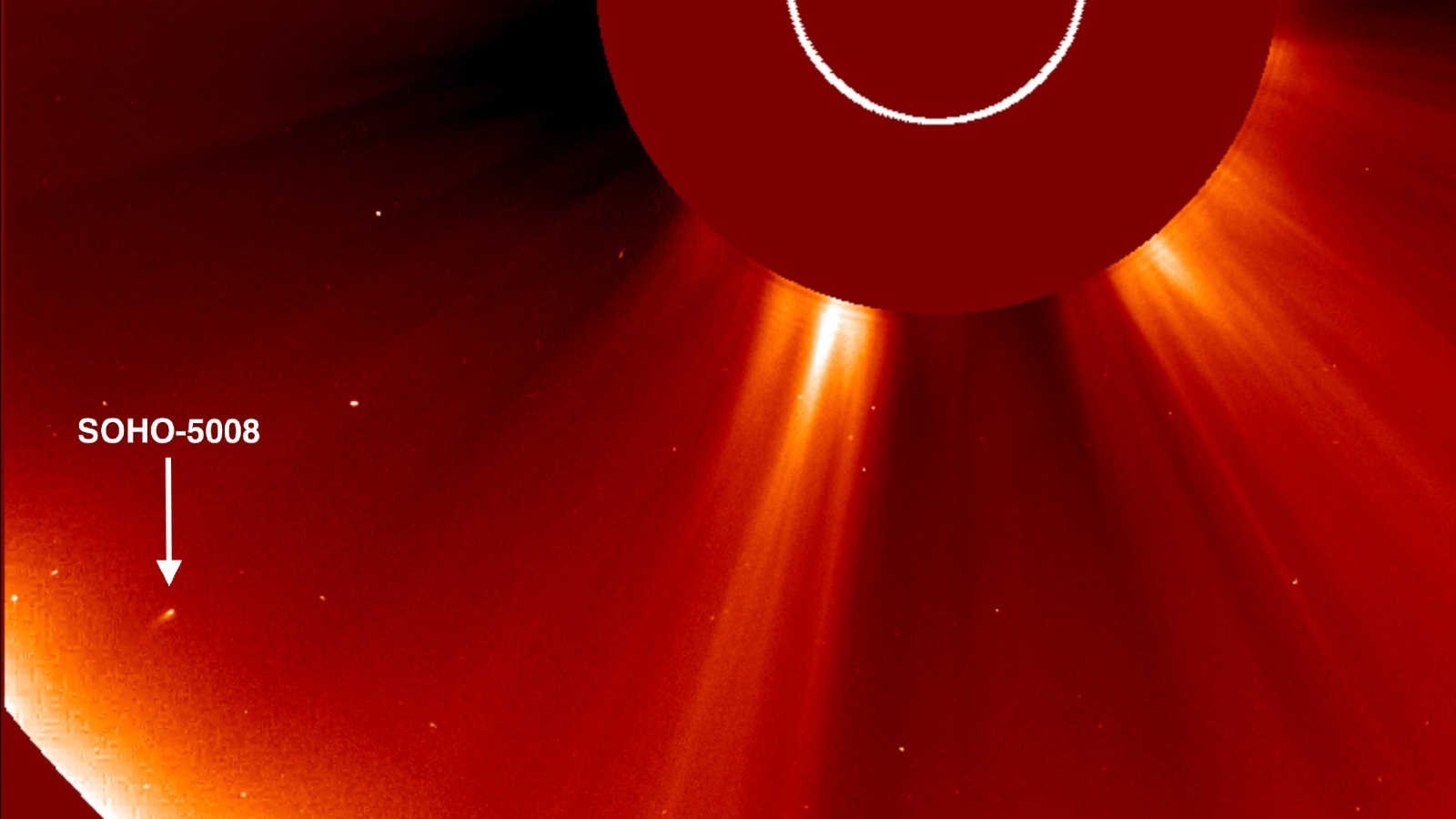 An orange coronagraph with an arrow pointing to the new comet