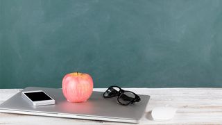 Back to School 2022: an image of a laptop, mouse and an apple on a school desk