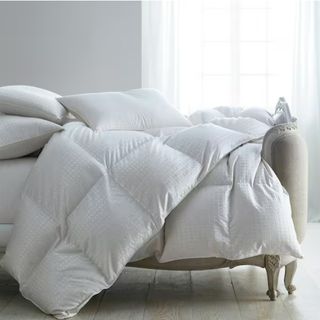 Goose Down Comforter on a bed.