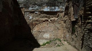 A horseshoe arch is pictured in the remains of what could be a 14th century synagogue in Utrera, Sevilla province, on March 18, 2021. - A technical team will begin the first phase of an archaeological work to confirm if the remains found in a former bar, previously used as a school and a hospital, originally was a 14th century synagogue that would be the second largest and most important Jewish medieval temple in Spain.