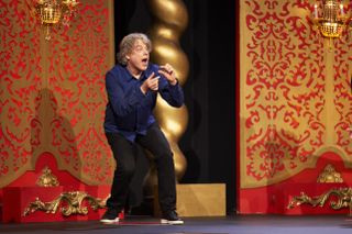 Alan Davies attempts to mime something for the Taskmaster in the live studio task — but what?