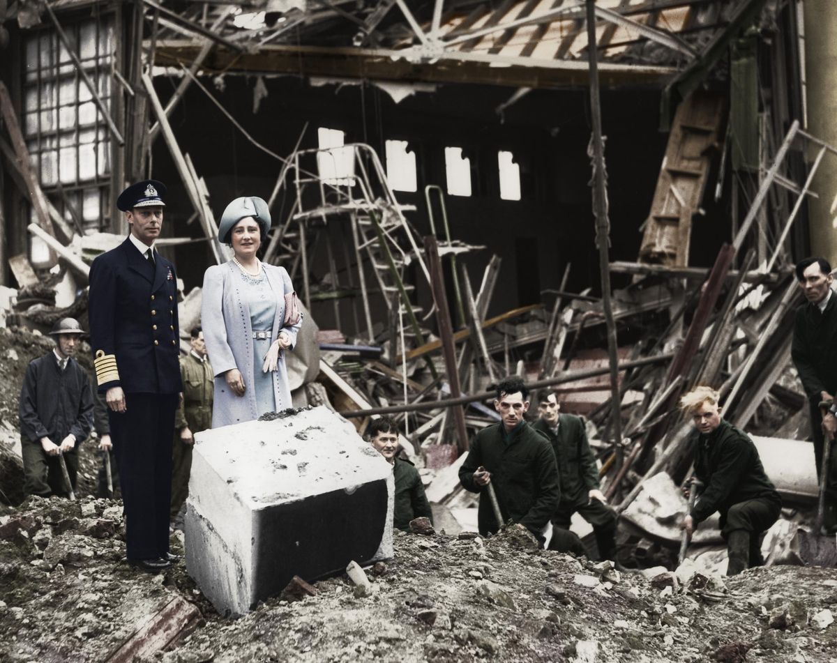 The King and Queen survey bomb damage, Buckingham Palace, London, WWII, 1940. King George VI and Queen Elizabeth looking at the aftermath of a German bombing raid on 11 September 1940 which destroyed the palace chapel. After the event the Queen famously said I&#039;m glad we have been bombed. Now I can look the East End in the face. The palace was bombed on seven occasions during the war