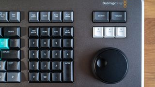 Blackmagic Davinci Resolve Editor Keyboard on a wooden surface