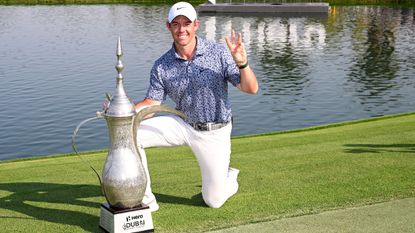 Rory McIlroy with the trophy after winning the 2023 Dubai Desert Classic