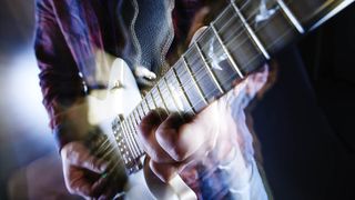 Close-up of guitarist playing a solo lick on a PRS Singlecut